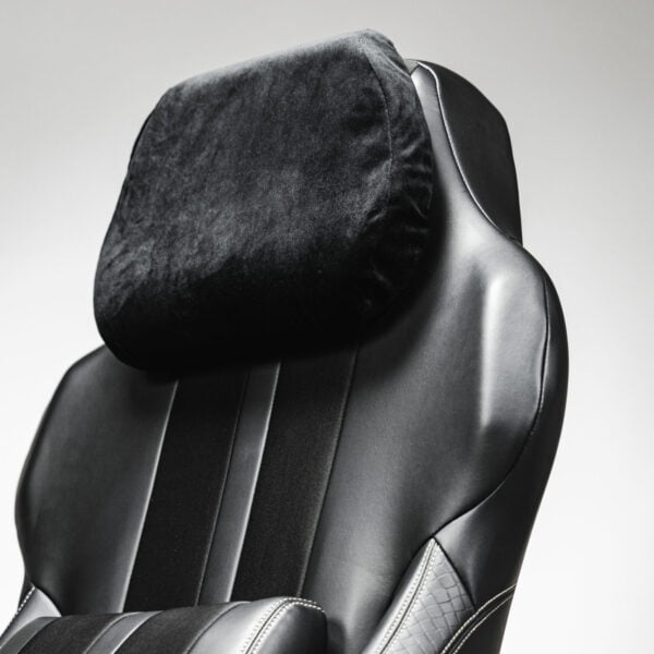 Close-up of a black cordless massage chair featuring a soft headrest pillow, designed for ultimate comfort and relaxation.