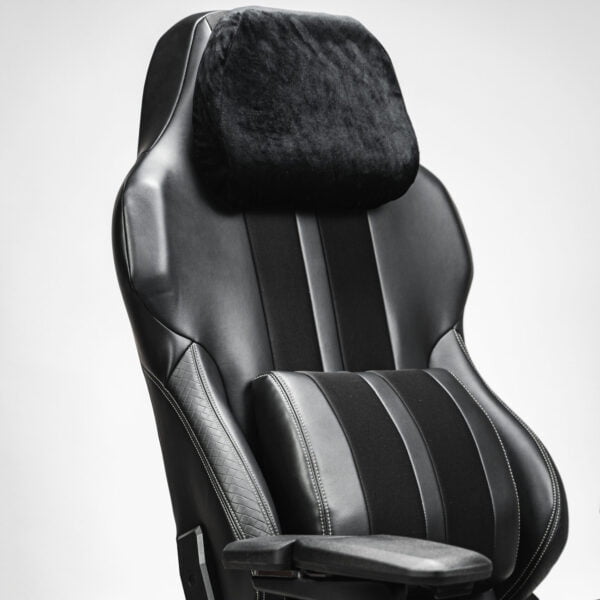 Side view of a black cordless massage chair, featuring a plush headrest pillow, ergonomic lumbar support, and adjustable armrests, designed for ultimate relaxation and comfort.