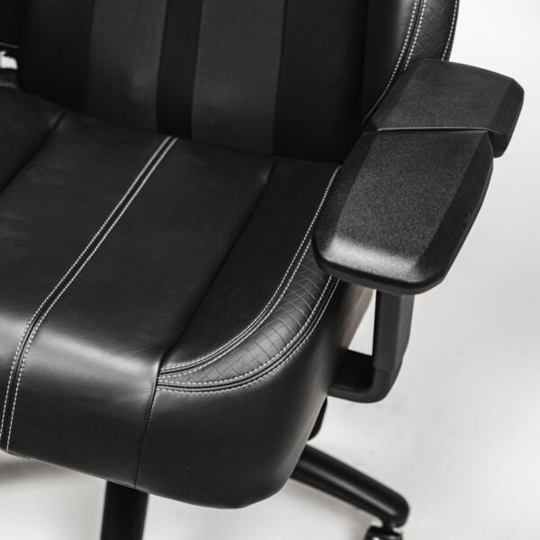 Side view of a black cordless massage chair, featuring a plush headrest pillow, ergonomic lumbar support, and adjustable armrests, designed for ultimate relaxation and comfort.Side view of a black cordless massage chair, featuring a plush headrest pillow, ergonomic lumbar support, and adjustable armrests, designed for ultimate relaxation and comfort.