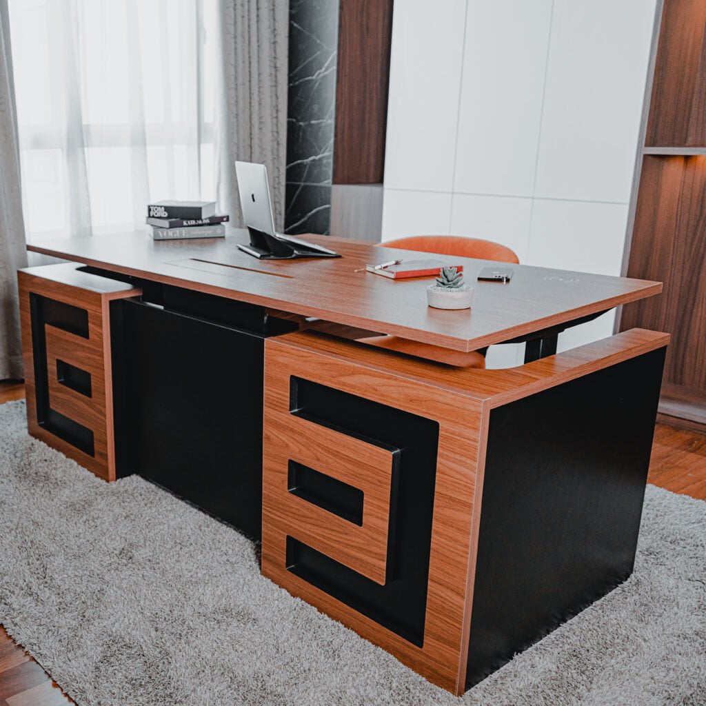 Elegant CEO office desk with a wooden finish and black accents, showcasing a sophisticated workspace setup.