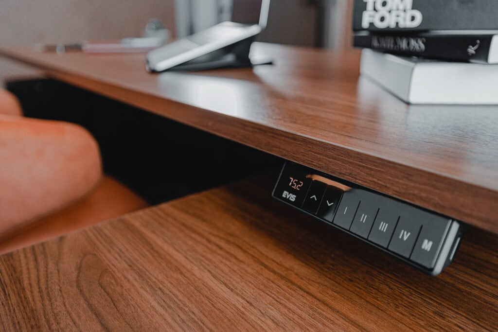 Height adjustment control panel embedded in the CEO desk, offering customizable settings for maximum comfort.